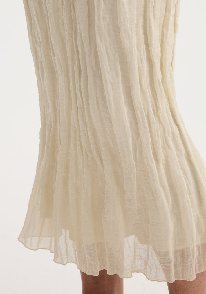 Textured tube skirt | cream, featuring a straight silhouette, vertical pleats, and tiered ruffles in crinkled gauze, draping mid-calf with an elastic waistband.