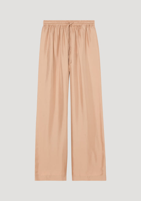 Wide leg silk trousers in soft beige, featuring an elasticated drawstring waistband and twill structure, designed with extra length for alterations.