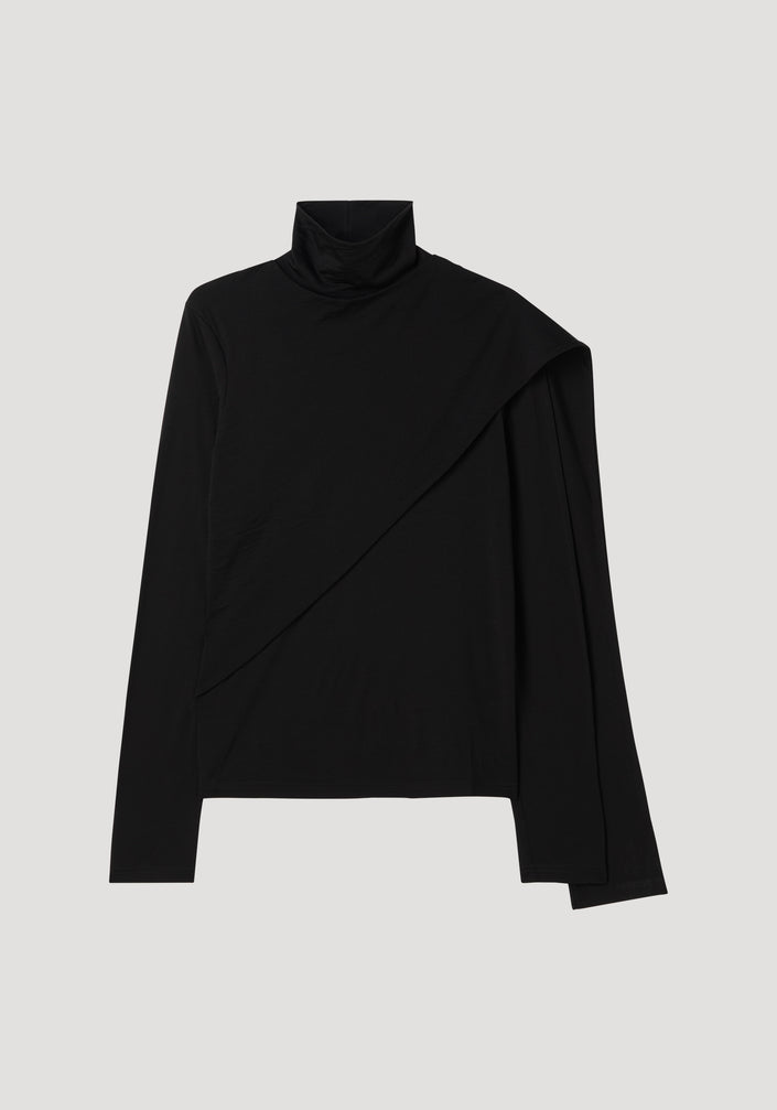 Soft jersey scarf top in black, featuring a long-sleeved turtleneck with an asymmetric triangular drape panel sweeping across the front for a layered look.