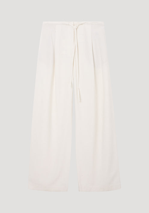 Relaxed drawstring trousers in winter white, featuring a wide-leg silhouette and a drawstring waistband, crafted from a soft silk blend fabric for comfort.