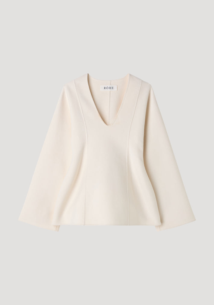 Sculptural long sleeve top | off white, featuring a deep V-neck, subtly flared sleeves, and an A-line silhouette with a small RÓHE label visible.