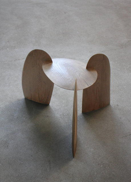 Sculpted Stool | 4673: A three-legged stool with interlocking curved plywood panels, crafted from sustainably harvested oak by Dutch artist Arne Kristian.