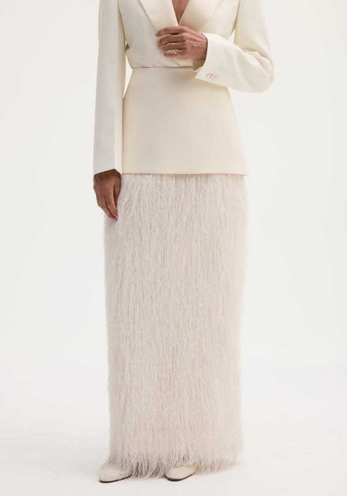 Ivory Fringe skirt with high-waist, full-length fringe detailing, and invisible zip, paired with an ivory blazer and cream pointed-toe shoes.