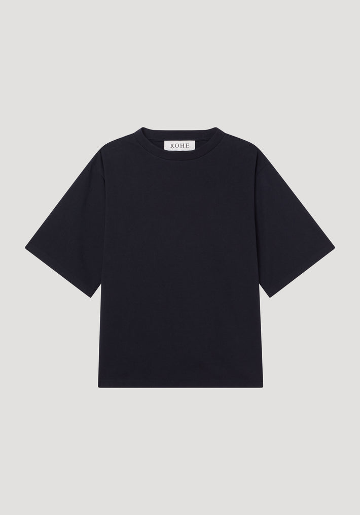 Oversized cotton t-shirt | black displayed flat on a light background, featuring a crew neckline and short wide sleeves in a relaxed fit.