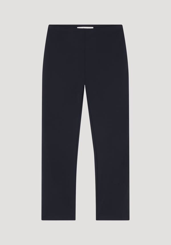Cigarette scuba trousers in black, laid flat, featuring a slim, ankle-length silhouette with a clean design, crafted from heavyweight scuba fabric.