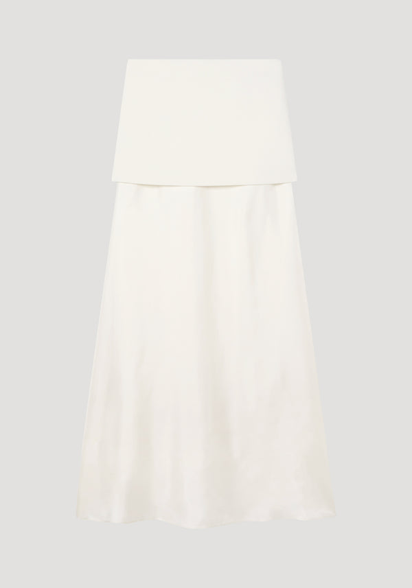 Integrated fluid silk skirt | cream showcases a strapless design with a high waist, featuring a wool top and silk skirt, offering texture contrast and a sculptural silhouette.