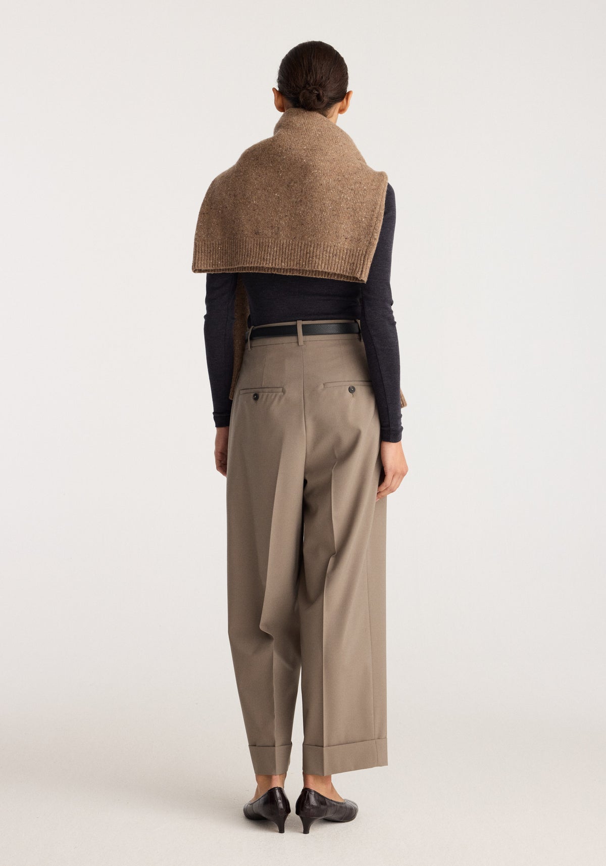 High-waist turn-up trousers | taupe shown from the back with wide legs belt loops and neatly folded cuffs on a model