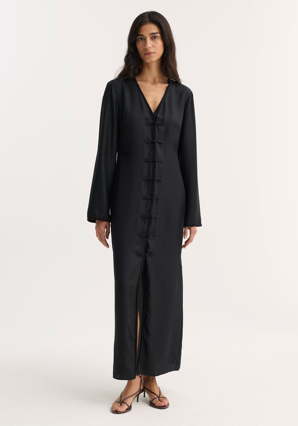 Mandarin silk dress | black: A full-length, V-neck silk dress with pankou closures and a front slit, worn by a model in strappy sandals.