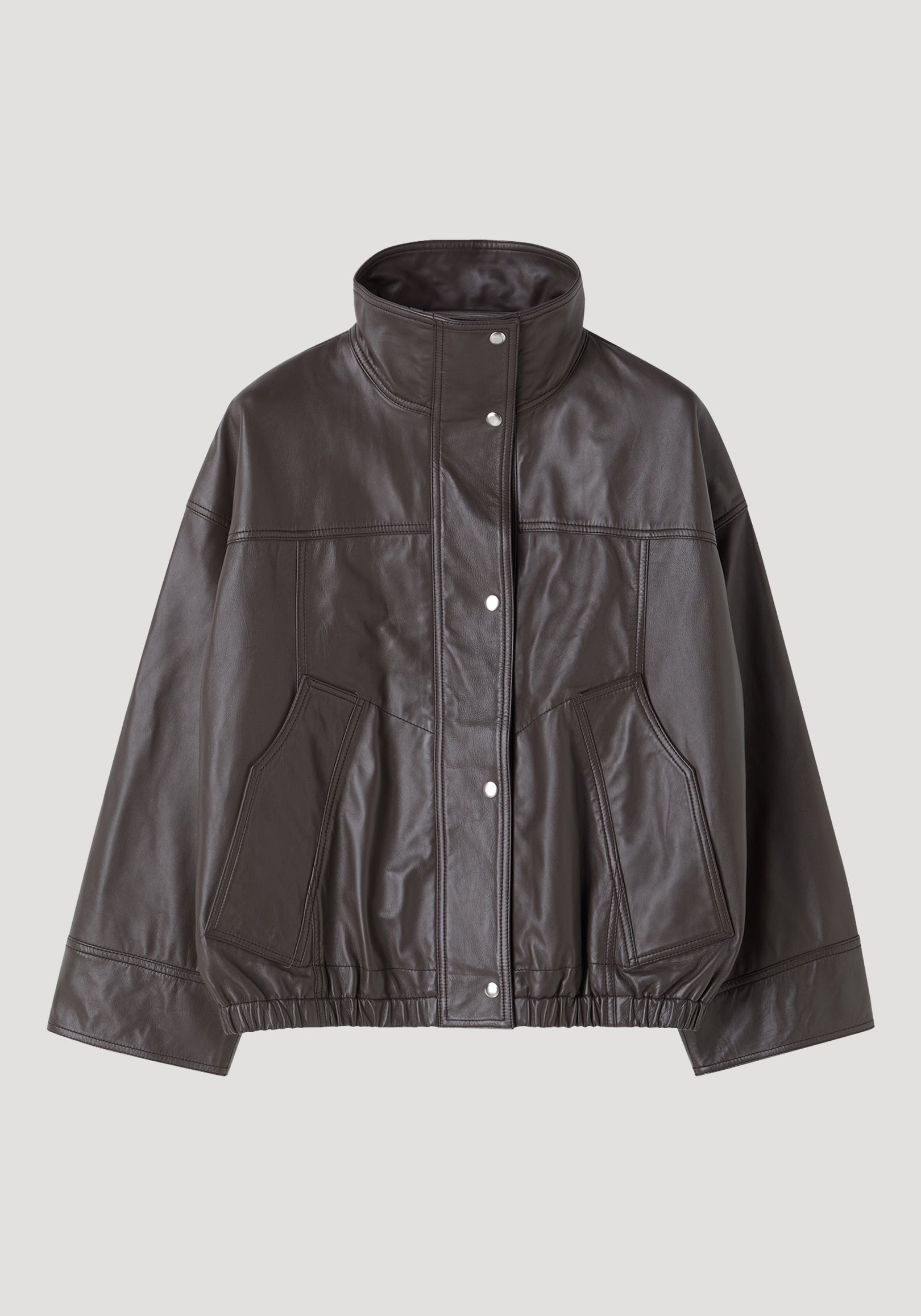 Reinvented leather jacket | earth features a dark leather bomber style with a stand-up collar, snap-button front, and elasticized hem, offering a relaxed, oversized fit.