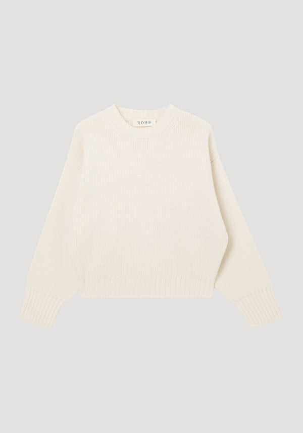 Sculptural compact crewneck by RÖHE, featuring an off-white, rib-knit design with long sleeves and dropped shoulders, crafted from 100% wool for a relaxed fit.
