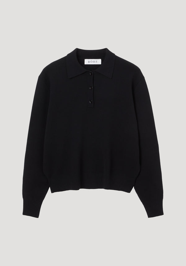 Compact knitted polo | black featuring a structured collar, three-button placket, ribbed cuffs, and hem. Crafted from a wool-cashmere blend with a relaxed, rounded drop shoulder.
