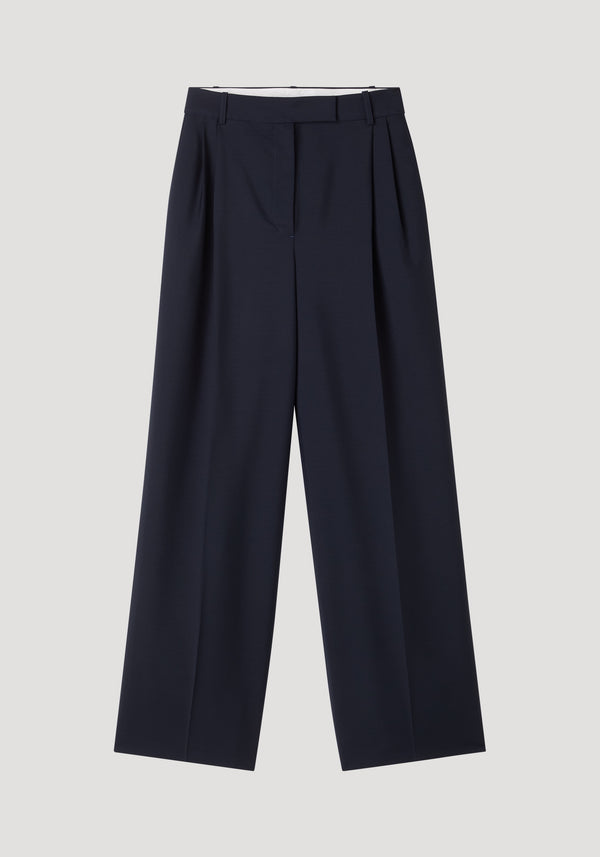Mid-waist tailored trousers in navy, featuring high-waisted design, wide-leg cut, belt loops, and subtle front pleats, crafted from a wool-mohair blend.