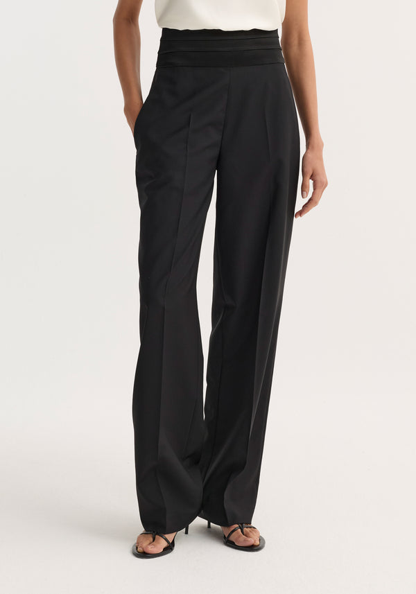 Cummerbund trousers | black, featuring a high-waisted, wide-leg design with front pleats and a broad waistband, paired with open-toe heeled sandals.