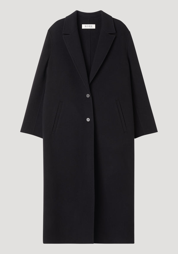 Double-faced coat | black: Long, single-breasted black overcoat with notched lapel, two buttons, slanted welt pockets, 100% wool, worn by model 178cm in size 36.