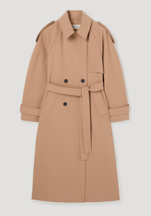 Oversized classic trench | powder features a double-breasted front, wrap belt, shoulder epaulets, and storm flap collar, showcasing modern refinement and structured detailing.