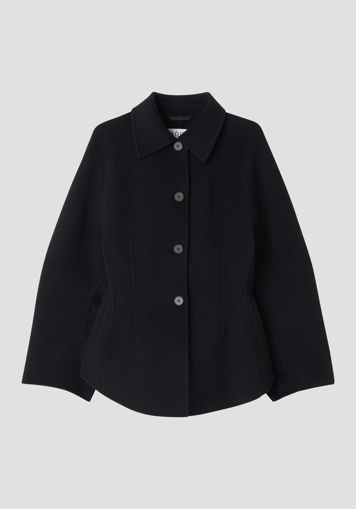 Black double-faced sculptural jacket with a pointed collar and four button closures, featuring a tailored fit and subtle seam detailing for a modern, minimalist look.
