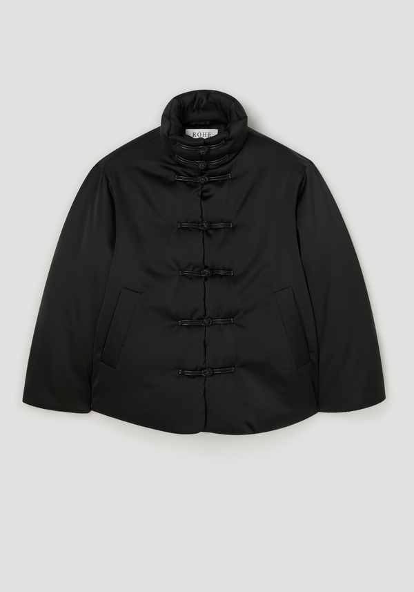 Padded puffer jacket | black with frog-style toggle closures, stand-up collar, slanted pockets, and water repellent finish; polyester exterior, cotton filling.