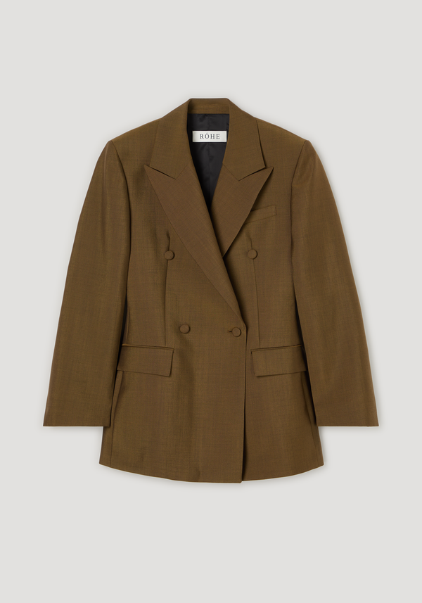 Double-breasted waisted blazer | golden brown featuring a sculpted hourglass shape, sharp notch lapels, oversized cut, and button-covered buttons, with RÓHE label inside.