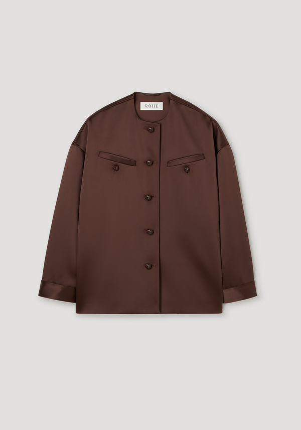 Western heavy satin jacket in espresso, featuring a collarless neckline, leather-knotted buttons, and high chest welt pockets for a relaxed, polished look.