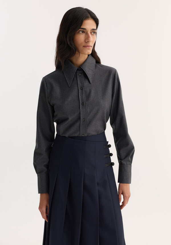 Model wearing Fitted shirt | dark grey melange, featuring a long-sleeved, button-down design with a sharp collar, crafted from 100% virgin wool flannel for a structured look.