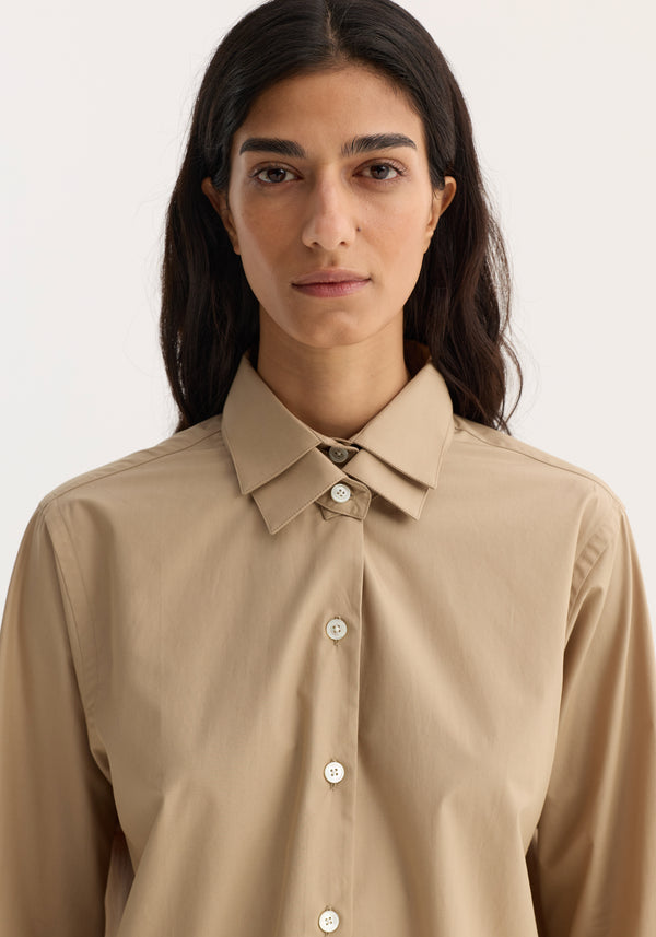 Person wearing Double collar shirt | wheat, featuring a detachable double-layer collar and off-white buttons, crafted from 100% cotton for a classic and refined look.