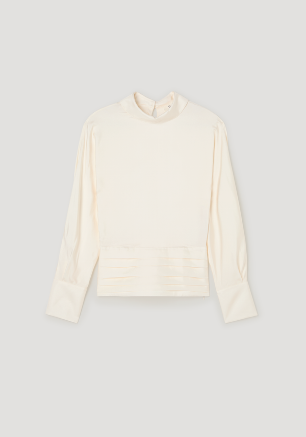 Tuxedo silk top in cream, featuring a mock neckline, voluminous long sleeves, pleated hem, and an open-back slit with cummerbund detailing.