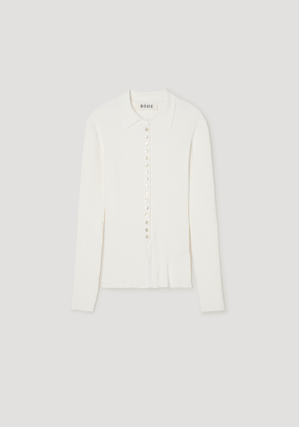 Elongated rib cardigan in off-white features a pointed collar, front buttons, and a slightly flared hem, crafted from rib-knit cotton crepe.