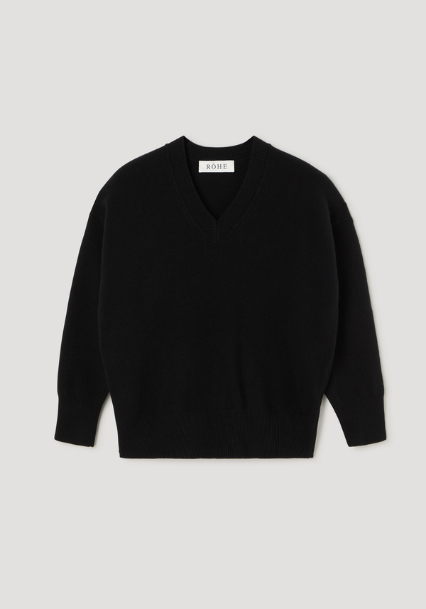 V-neck knitted jumper | black featuring a relaxed fit with a V-neckline, long sleeves, ribbed cuffs and hem, and a RÓHE label at the neck.