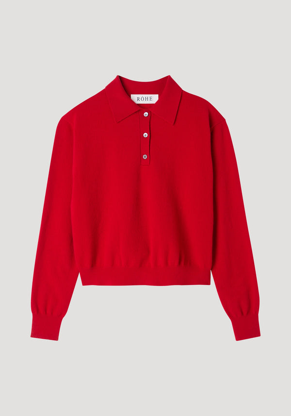 Wool cashmere polo | red features a bright red long-sleeve knit with a structured collar, three-button placket, and ribbed cuffs and hem.