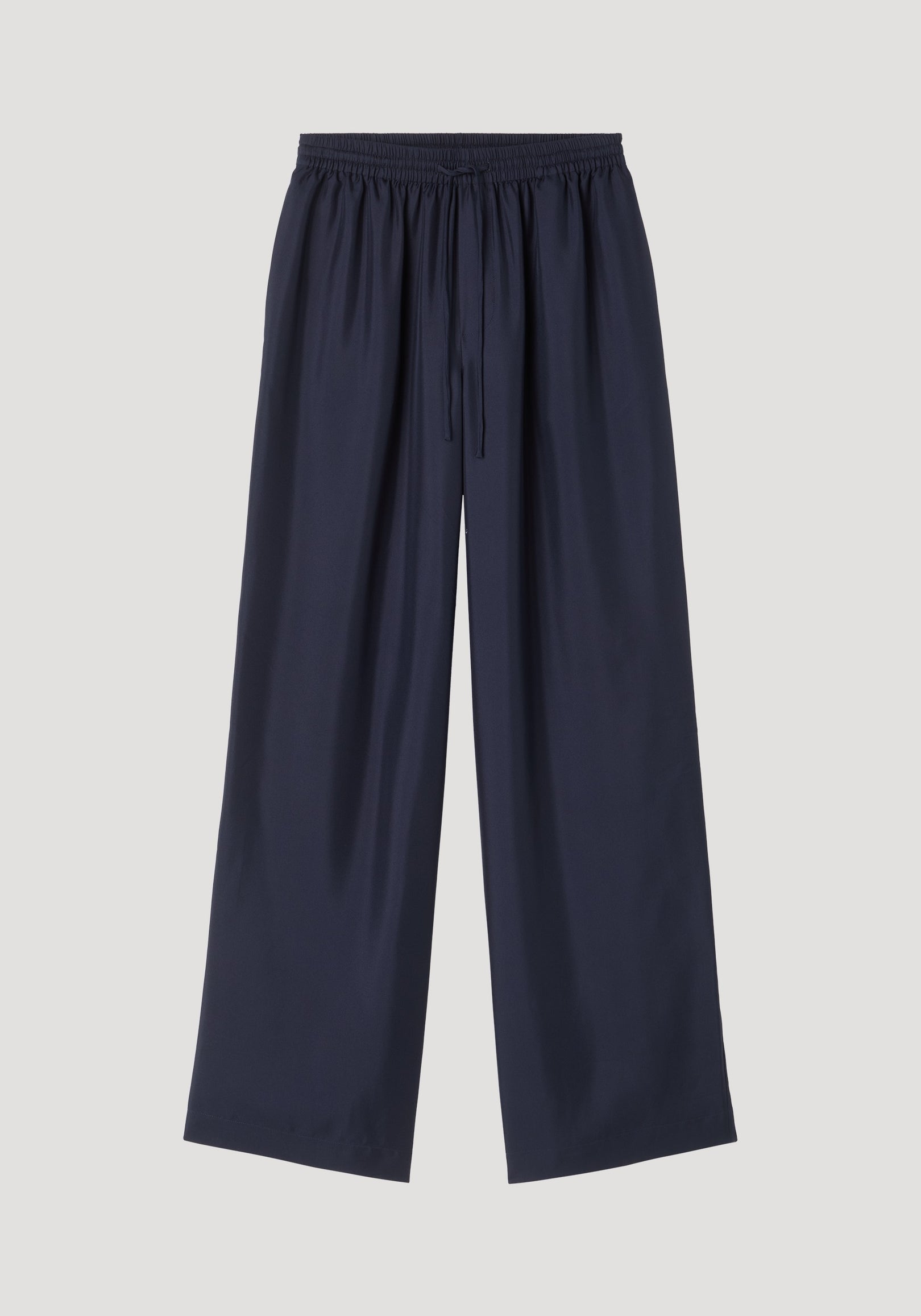 Wide leg silk trousers | night featuring a relaxed, loose-fit silhouette with an elastic waistband and drawstring, crafted from 100% silk twill for natural fluidity.