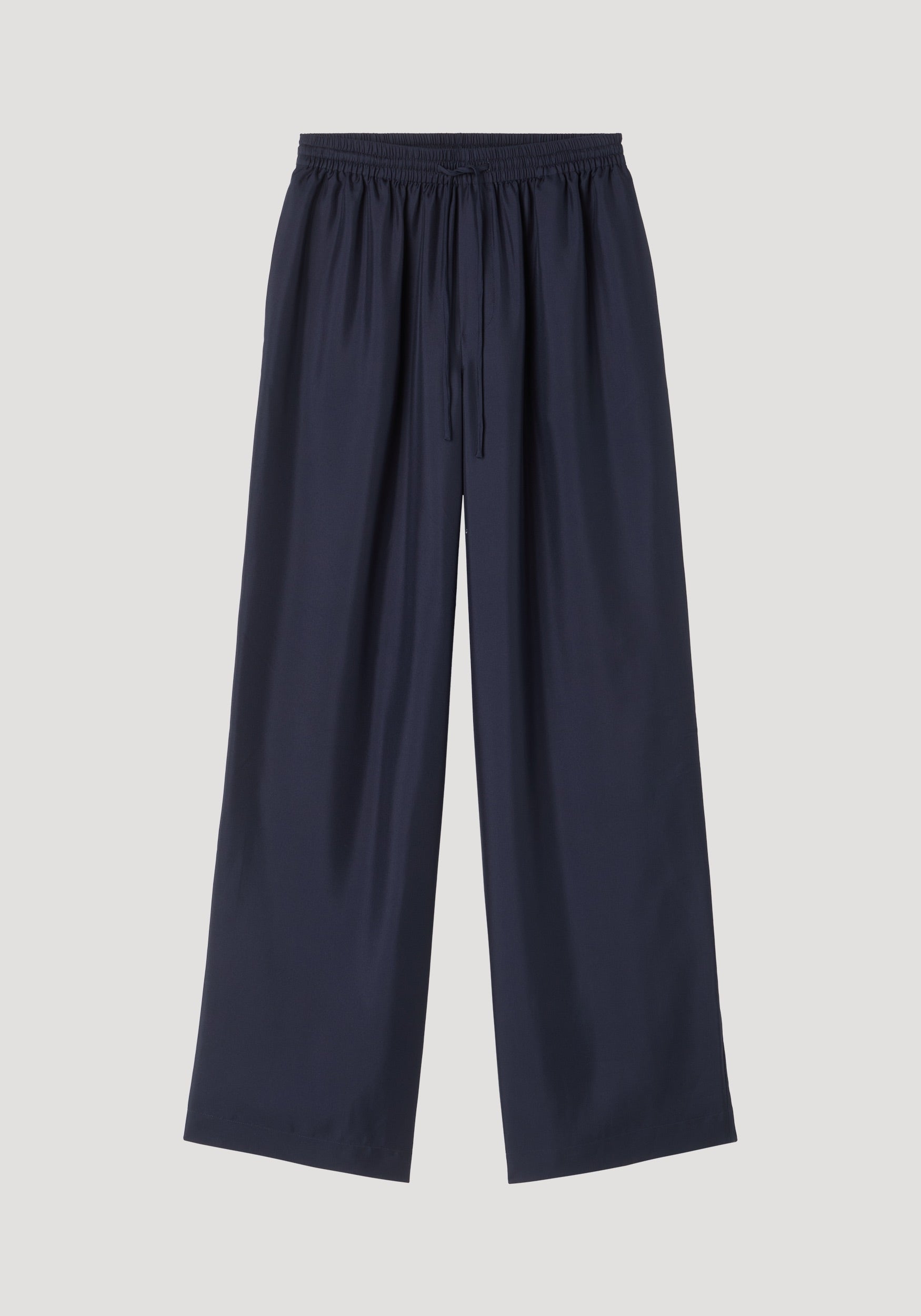 Wide leg silk trousers | night featuring a relaxed, loose-fit silhouette with an elastic waistband and drawstring, crafted from 100% silk twill for natural fluidity.