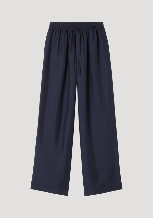 Wide leg silk trousers | night featuring a relaxed, loose-fit silhouette with an elastic waistband and drawstring, crafted from 100% silk twill for natural fluidity.