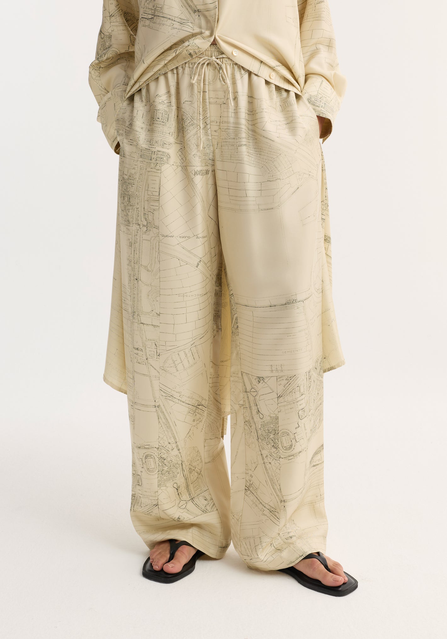 Wide leg silk trousers with Amsterdam map print, featuring an elasticated waistband and drawstring, offering a relaxed drape and natural fluidity in pure silk twill.