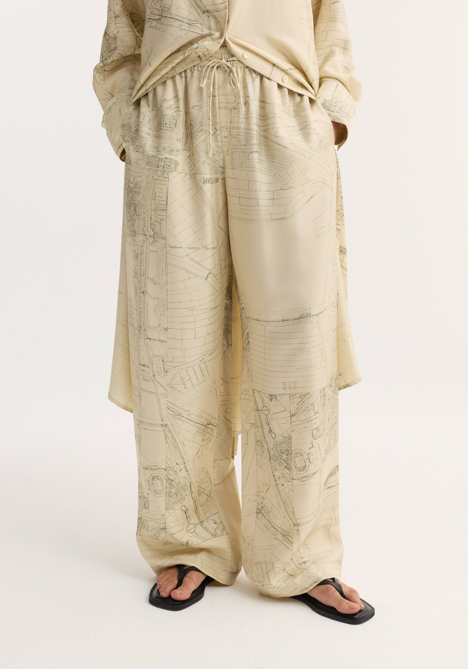 Wide leg silk trousers with Amsterdam map print, featuring an elasticated waistband and drawstring, offering a relaxed drape and natural fluidity in pure silk twill.