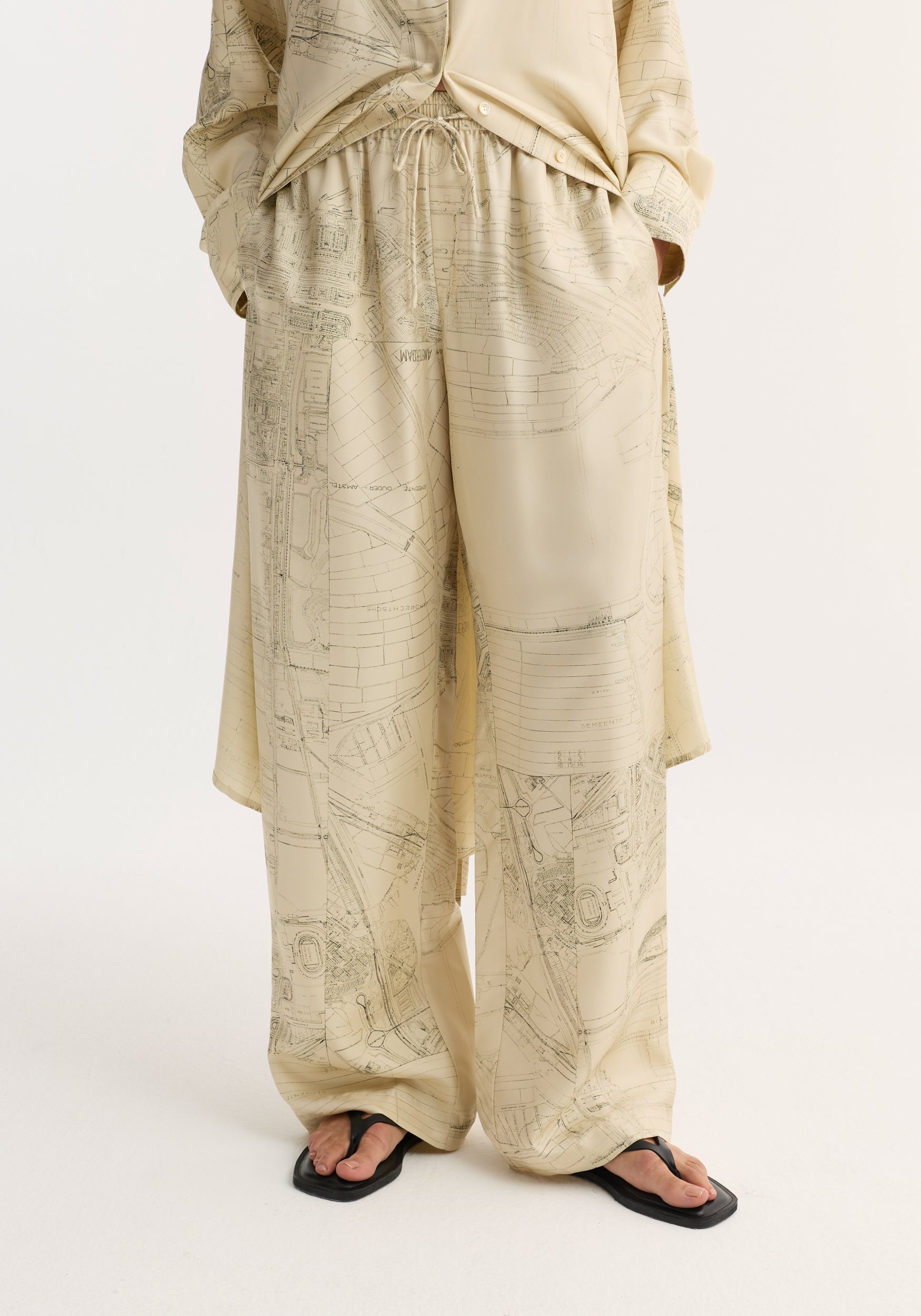 Wide leg silk trousers with Amsterdam map print, featuring an elasticated waistband and drawstring, offering a relaxed drape and natural fluidity in pure silk twill.