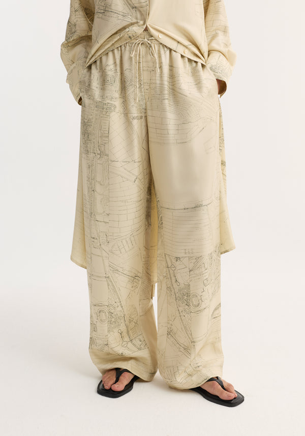Wide leg silk trousers with Amsterdam map print, featuring an elasticated waistband and drawstring, offering a relaxed drape and natural fluidity in pure silk twill.