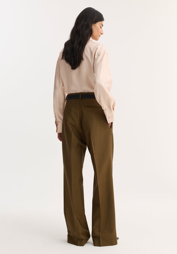 Person wearing Relaxed straight leg trouser | golden brown, showcasing a tailored fit with high-waisted design, sharp front pleats, and clean side pockets.