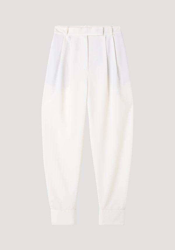 Barrel leg trousers in off-white, featuring high-rise design, soft pleats, tapered legs, and ankle cuffs for a modern silhouette.