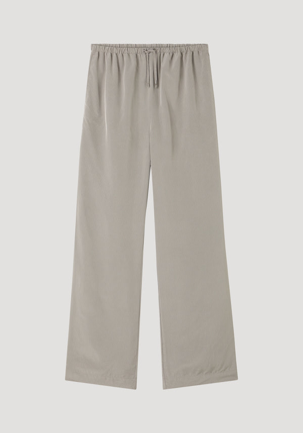 Relaxed fit trousers in light grey stripe, featuring wide legs, elastic drawstring waistband, fine rib texture, and side seam pockets, crafted from 100% viscose.