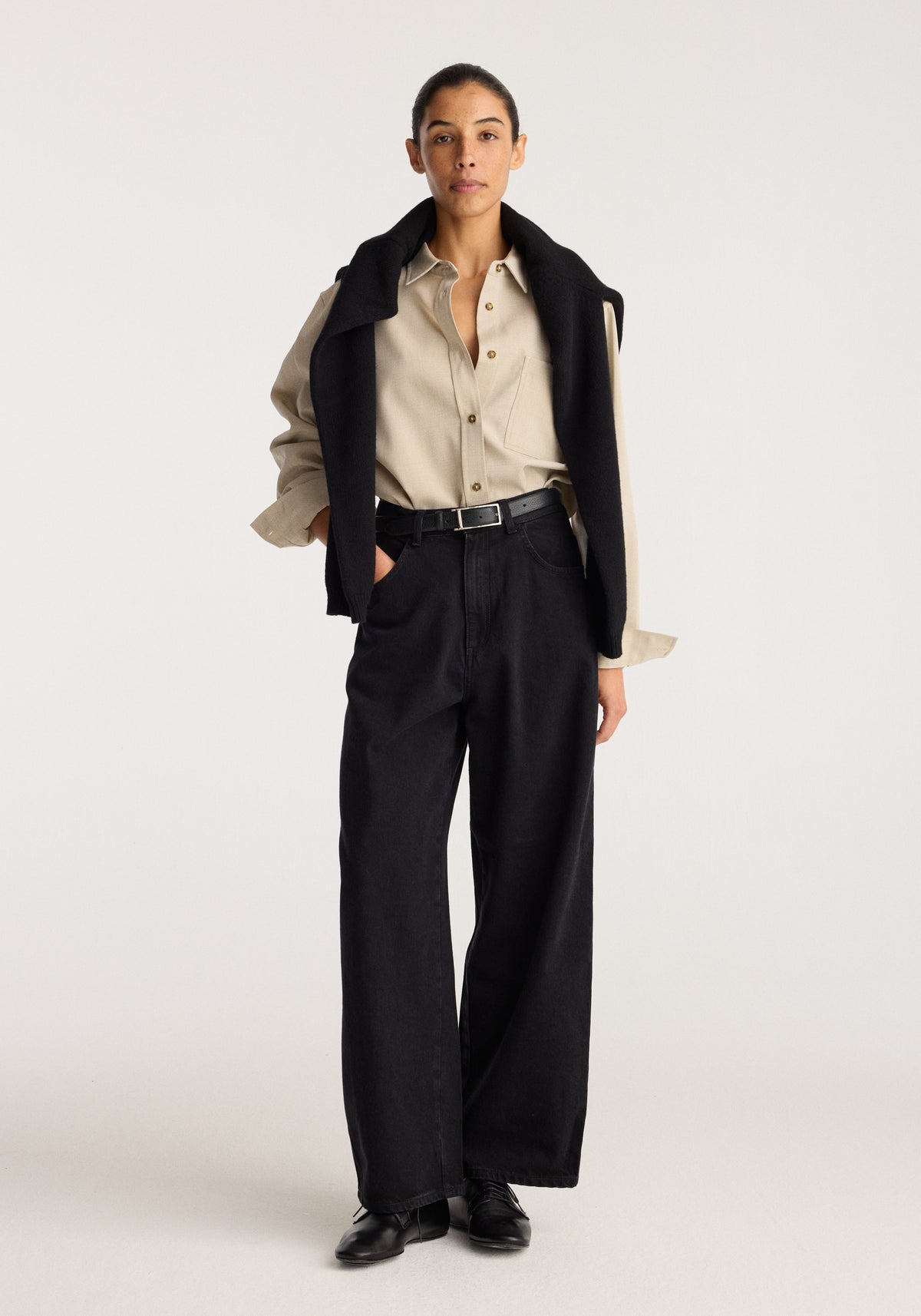 Berber - Barrel leg denim | black worn by a model in a full length studio photo showing the high waist and relaxed barrel leg silhouette