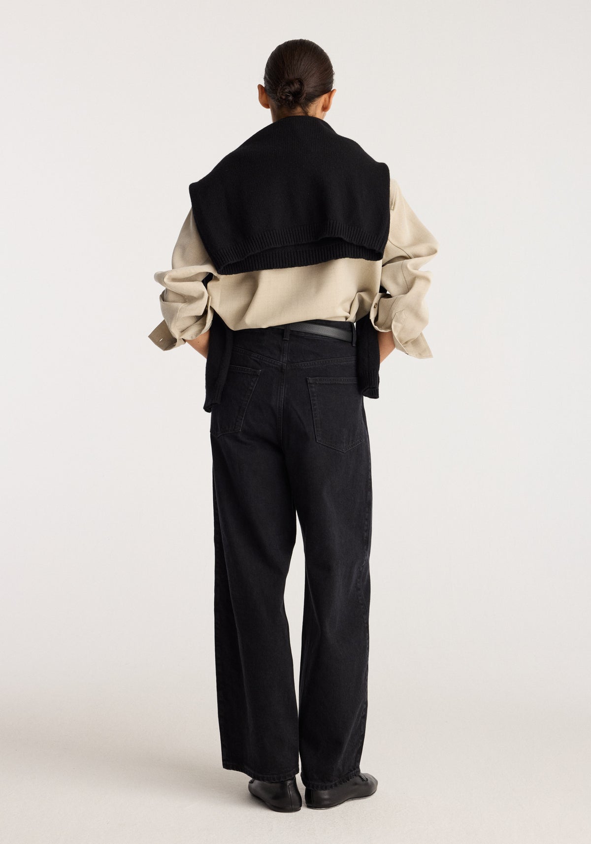 Berber - Barrel leg denim | black shown from the back on a model with a high waist and relaxed barrel leg silhouette in black denim