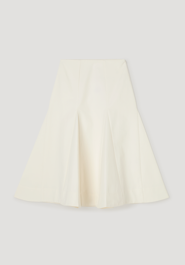 Sculptural cotton skirt in paper white, featuring a high-waisted, A-line silhouette with flared, mermaid-style hem and structured pleats for added volume.