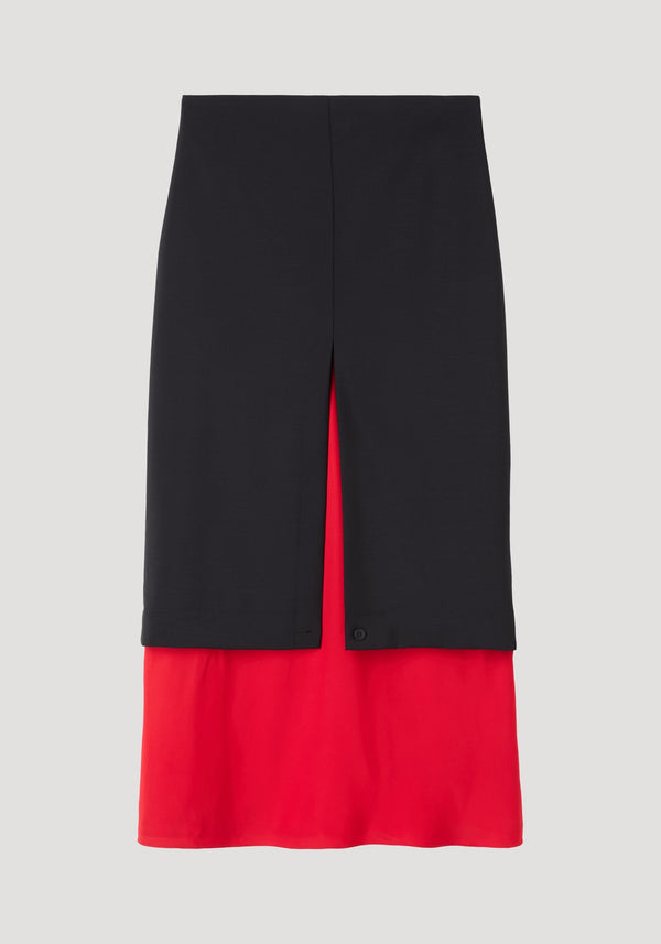 Contrast upside-down skirt | black, featuring a knee-to-mid-calf length black layer with a front slit, revealing a red under-skirt. Tapered silhouette in wool and viscose.