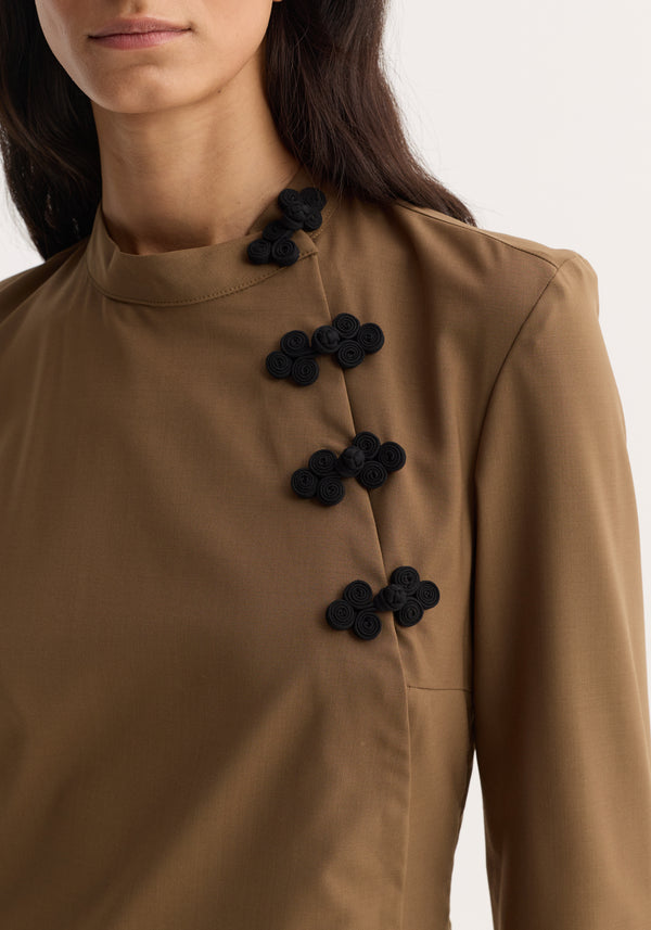 Mandarin Dress | mocha featuring long sleeves, high neck, and decorative asymmetrical pankou closures, highlighting the tunic's modern reinterpretation of traditional elements.
