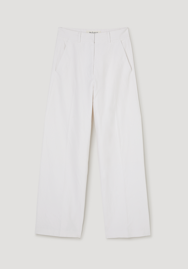 Classic loose fit chino in optic white, showcasing a relaxed baggy design with a tailored waistband, slanted side pockets, and wide, elongated legs.