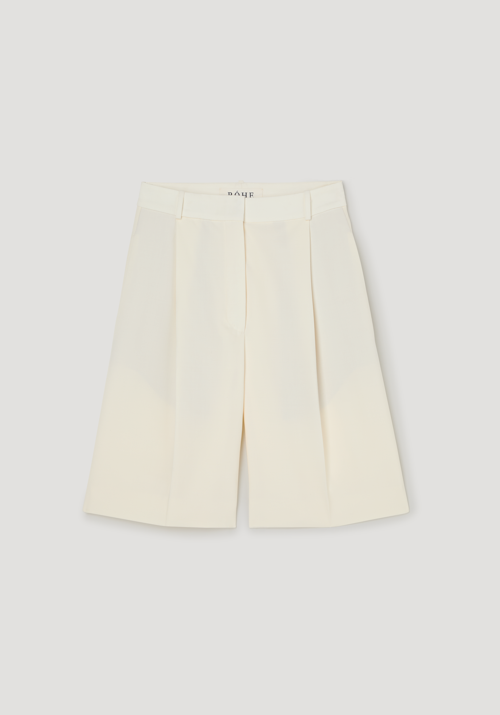 Tailored single pleat shorts | off white featuring high-waisted design, knee-length cut, wide-leg culottes style, and side pockets, crafted from 100% virgin wool.