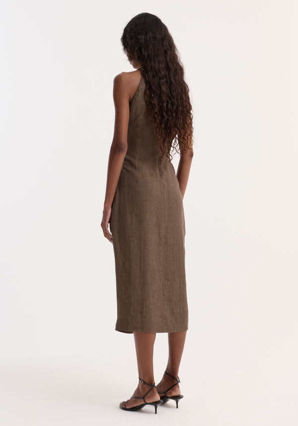 Woman in Sarong dress | brown melange, calf-length, sleeveless, high neckline, with a sarong-inspired knot at waist, wearing black sandals.