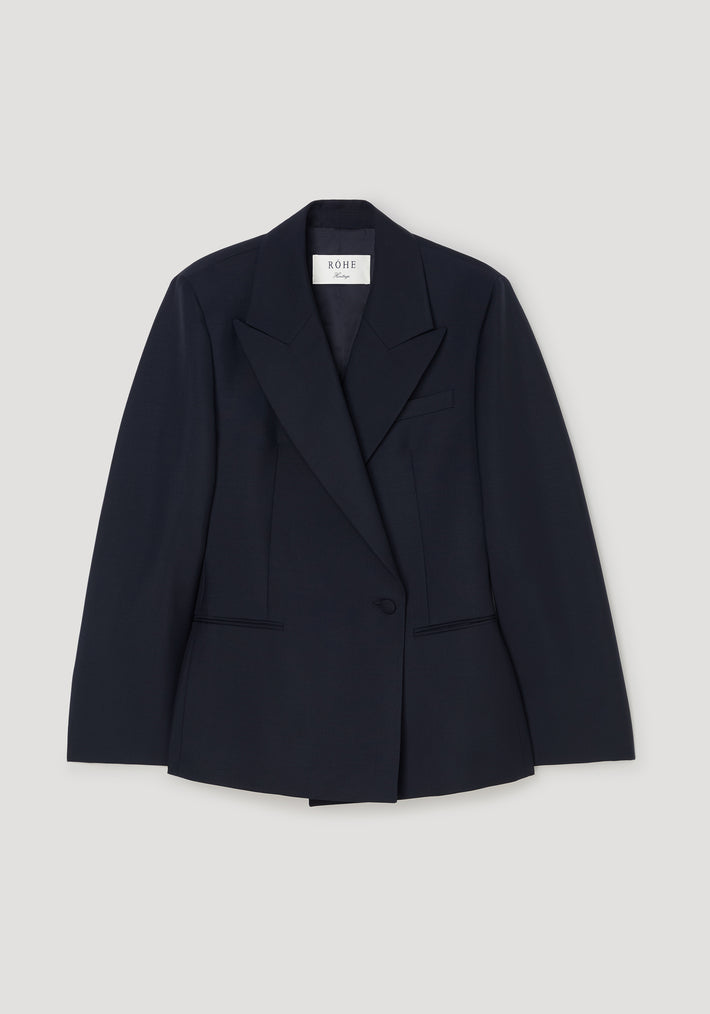 Hourglass shaped blazer | navy in a tailored fit with a single-button closure, notched lapels, and long sleeves, displayed on a light background.