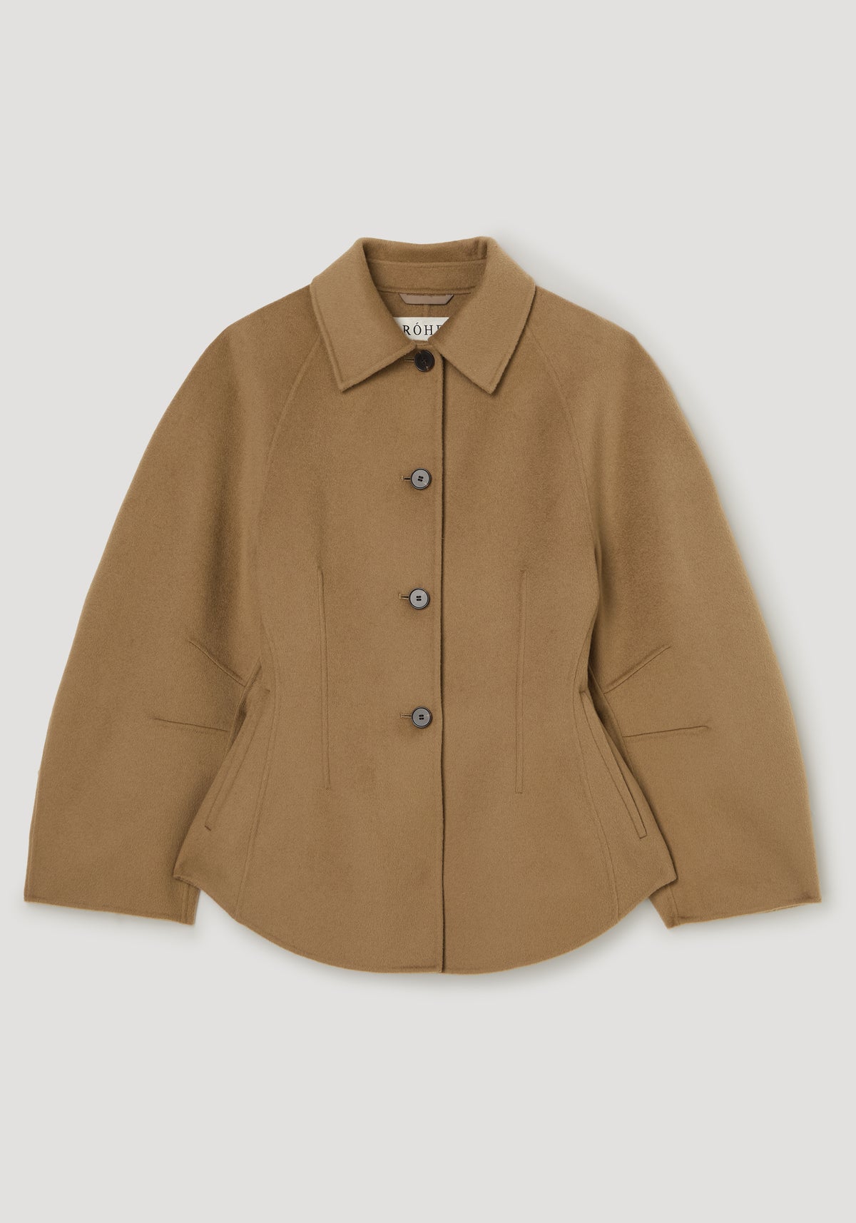 Double-faced sculptural jacket | camel, camel jacket with pointed collar, front buttons, long sleeves, curved hem, and angled welt pockets