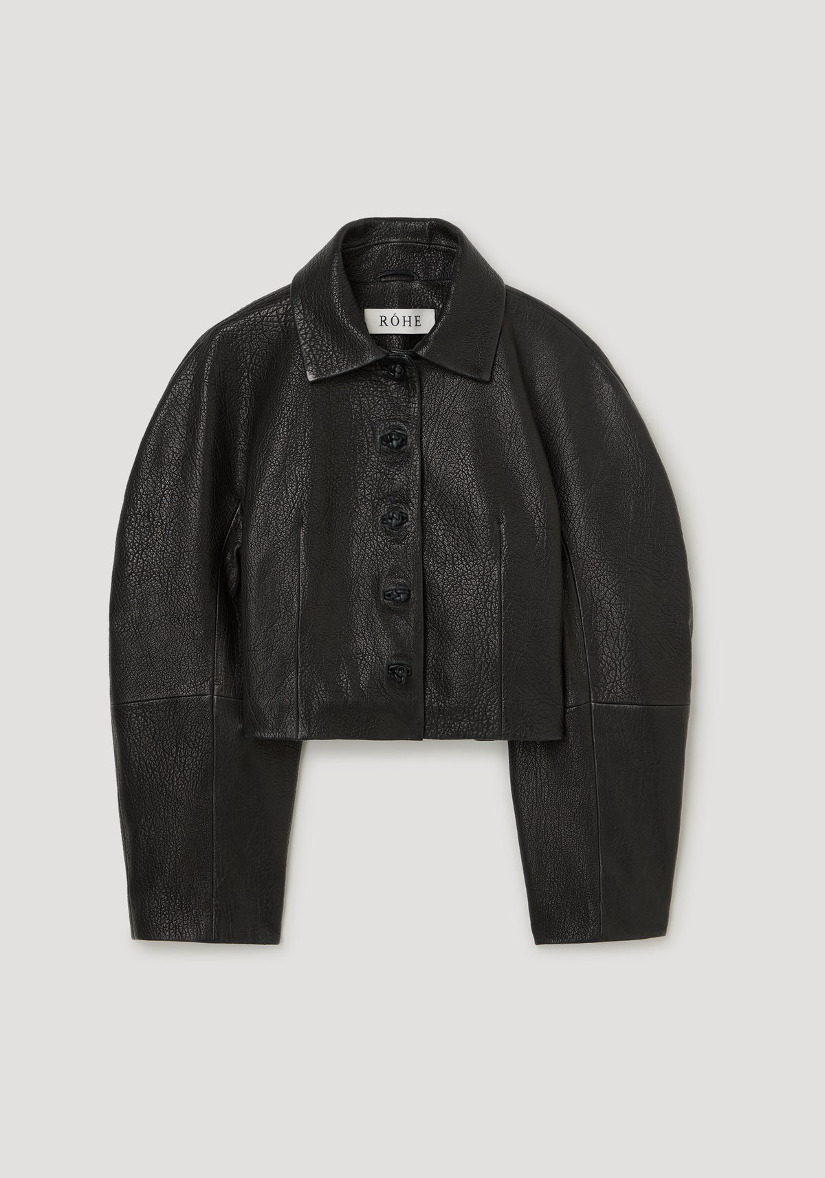 Rounded grain leather cropped jacket | black shown from the front with a pointed collar, button closure, long sleeves, and a cropped hem on a neutral background